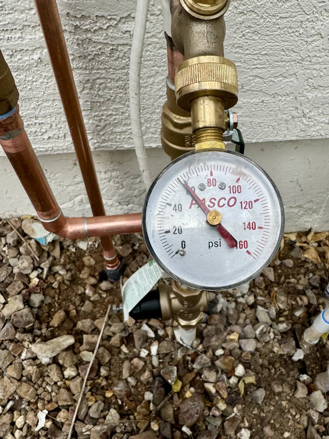 Pressure gauge on a copper water line during a water pressure test